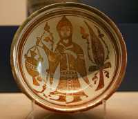 22 - Prêtre copte potant une lampe, près d'un cyprès (fin 11°s)